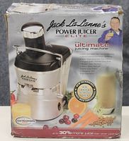 Front of box showing Jack LaLanne's Power Juicer Elite with promotional text about juicing benefits and features.