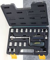 Opened Mastercraft socket and ratchet set showing organized sockets, ratchet wrench, bits, and screwdriver handle inside black and yellow carrying case.