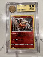 Front view of the graded Charizard card showing full design and protective case.