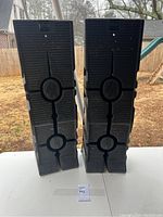 Set of two black Rhino Ramps stacked vertically showing non-slip tread and logo.