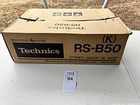 Box with brand and model labeled as Technics RS-B50 stereo cassette deck made in Japan.