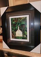 Full view of the framed Emily Carr print 'Indian Church' showing frame, matting, and artwork.