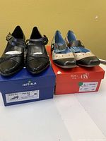 Two pairs of brand new ladies shoes shown with their boxes, size 39, imported from Europe.
