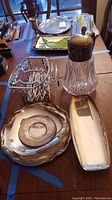 Photo showing all trivets, serving trays, and the crystal tea carafe on a table