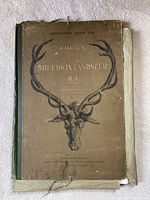 Photo of the booklet cover showing title, stag head illustration, and wear.