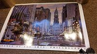 Avenue of the Arts Philadelphia poster showing detailed cityscape with Philadelphia city hall and busy street scene under evening sky.