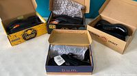 Three pairs of men's black leather shoes in original branded boxes