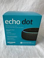 Front view of the Amazon Echo Dot 3rd Generation sealed box showing branding and product image.