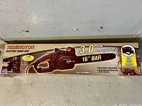 Full boxed Remington electric chain saw with product image and key features on the box
