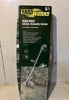 Box front showing Yardworks branding and 12 inch cutting path indication.