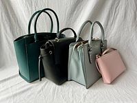 All four handbags lined up front view