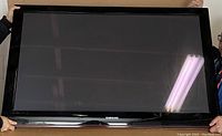 Front view of Samsung 50 inch plasma TV showing black screen and bezel with Samsung logo.