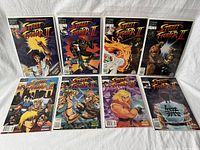 Photo of all 8 Street Fighter II comic issues laid out in two rows, showing full front covers, featuring various characters from the series in dynamic poses.
