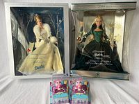 Two vintage limited edition Barbie dolls in original boxes and two small Barbie animal friend figures in original packaging.