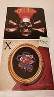 Front covers of both vinyl records, Krokus Headhunter and X Ain't Love Grand, placed side by side on a flat surface.