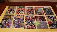 Ten Marvel comic books including six Spider-Man comics and four others. Covers show Spider-Man in various action poses and additional characters such as Venom and Punisher.