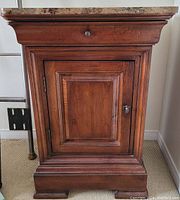 Front view showing drawer and cabinet door details