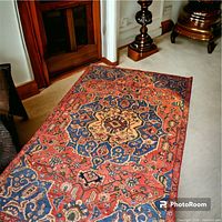Full view of the Bakhtiary tribal wool rug showing the central medallion pattern and overall colors.