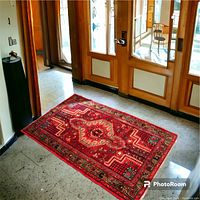 Rug laid in entryway showing full dimensions and how it looks in room setting