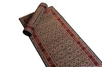 Partial roll showing intricate floral pattern and edge detailing