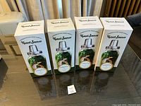 Four boxed Kraut Source fermentation kits arranged on a table showing brand and packaging.
