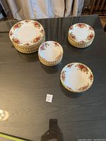 Overhead view of entire dinnerware set with stacks of plates and bowls