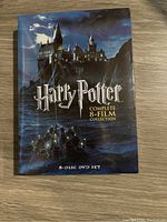 Hardcover slipcase with Hogwarts castle image and title on front.