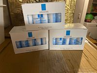 Three boxes of La Roche-Posay Toleriane Gentle Face Cleanser sample tubes, each box containing 15 tubes of 15 ml size.