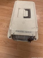 Top view showing beige plastic housing and handle