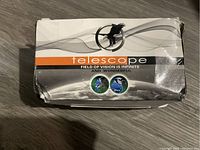 Top view of the telescope box showing brand label and bird image design