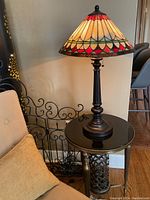 Lamp lit on table showing full lamp and shade colors, base profile