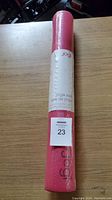 Rolled pink Jogi yoga mat wrapped in plastic with label confirming brand and new condition.