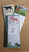 Front view of the three magnetic notepads stacked showing the themed animal graphics and pun designs.
