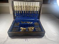 Complete set arranged in wooden box, top lid open