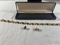 Necklace and clip-on earrings displayed in Franklin Mint presentation box