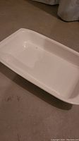 White ceramic rectangular baking dish interior view showing plain white interior and rectangular shape