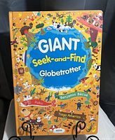 Cover of the GIANT Seek-and-Find Globetrotter children's book with colorful illustrations and a globe on the front.