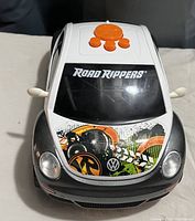 Front view of white and black Road Rippers toy car with detailed graphics and Volkswagen emblem on hood.