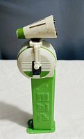 Front view of vintage Star Wars R2-D2 PEZ candy dispenser showing green stem and white-green dome-shaped head.