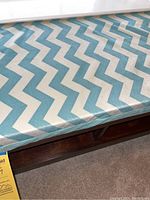 Top view of the detachable cushion showing blue and white chevron fabric pattern.