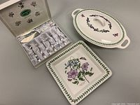 Overview of the covered serving dish, square plate, and boxed cake fork and slicer set, showing patterns and condition