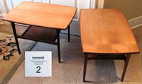 Front view of both teak end tables on tiled floor