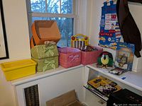 Overall photo showing all included woven and plastic storage bins, toys, and collectibles on windowsills and shelves.