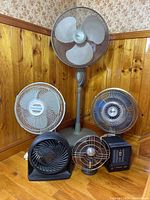 Photo showing the full set of six fans and heaters arranged together in a corner.