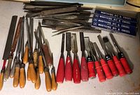 Full lot view with various files, chisels and mortising bit sets in original boxes.