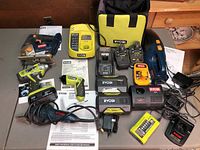 Overhead view of all tools, chargers, batteries and bag
