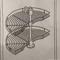 Illustration showing the two-tier two half-circle rotating wire baskets mounted on a central pole.
