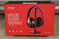 Front view of the factory sealed Mpow 059 Bluetooth headphones box showing headphone image and branding.