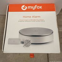 Factory packaging box of MyFox Home Alarm system with branding and product image.