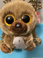 Close-up photo of Henry The Bear showing detailed facial features and attached TY tag.